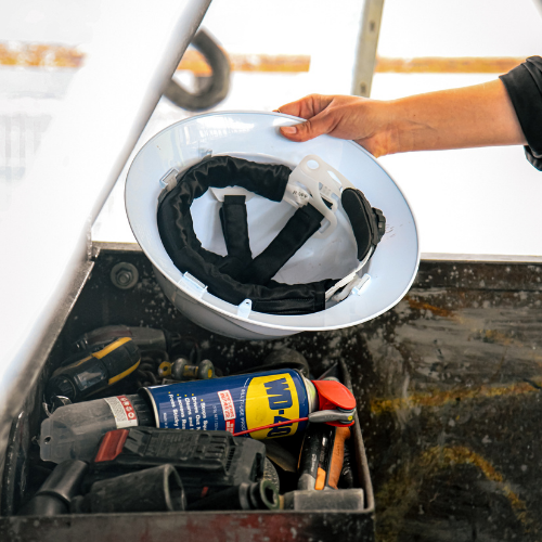 Worker holding hard hat in hand with fitted Ruff Supplied sweatband