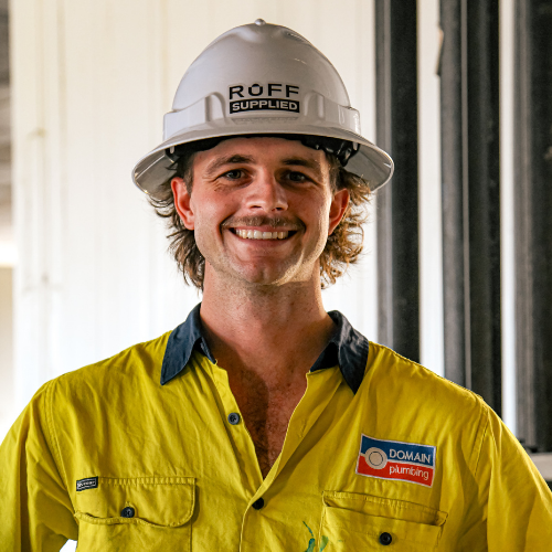 Tradie wearing a hard hat with a fitted Ruff Supplied sweatband