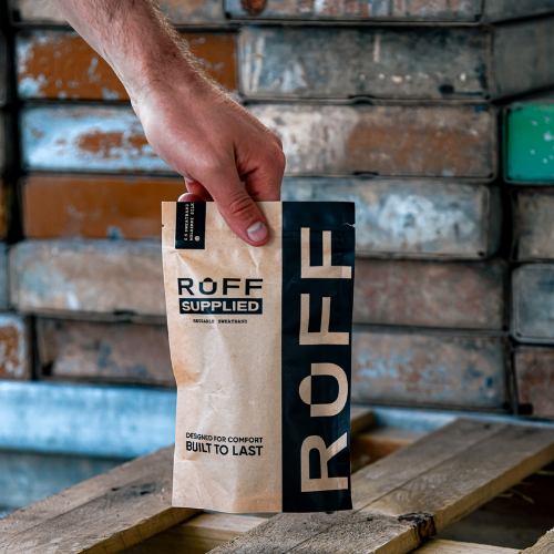 Customer holding the Ruff Supplied sweatband packaging