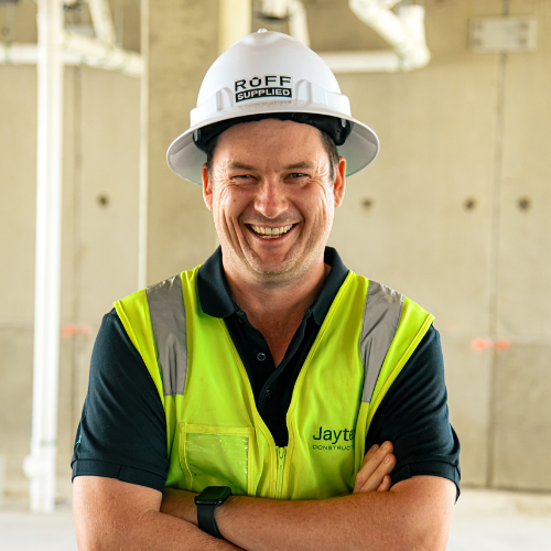 Tradie wearing a hard hat with a fitted Ruff Supplied sweatband