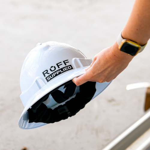 Worker holding a hard hat with a fitted Ruff Supplied sweatband in their hand